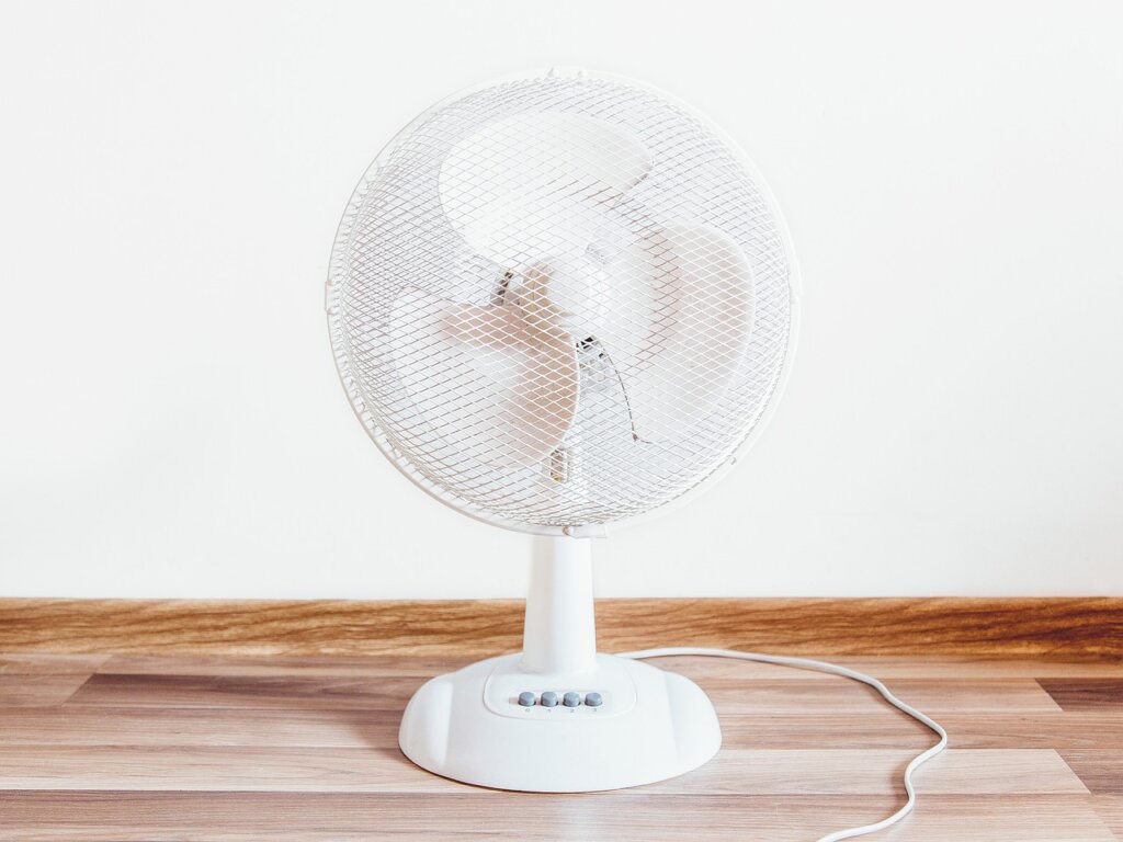 electric fan circulating air in small room