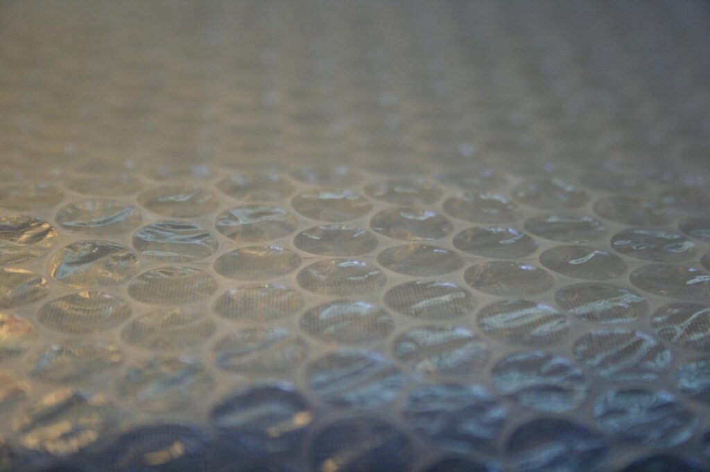 bubble wrap and newspaper used for fragile item packing