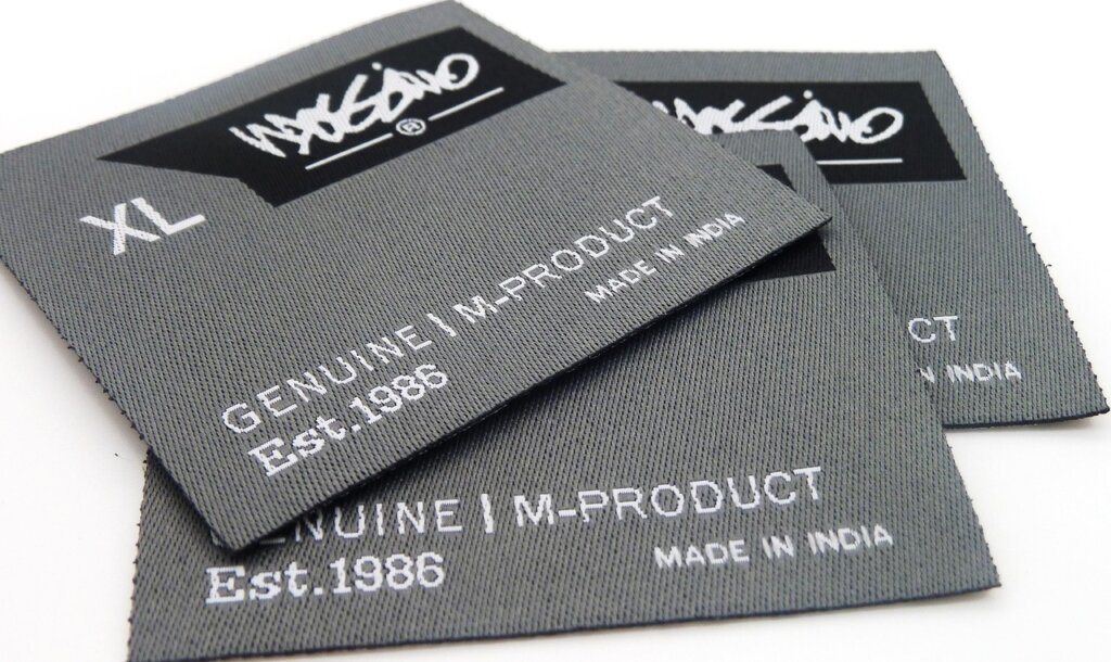 clothing care label tags showing washing temperature symbols