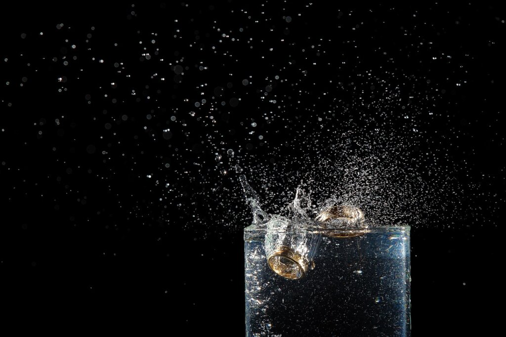 glass of water with perilla leaves stems submerged in refrigerator