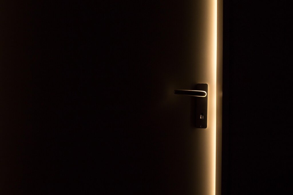 elderly mother opening wardrobe door to ventilate with sunlight streaming in