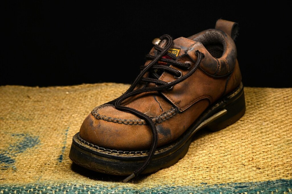 worn sneakers with bad smell on floor