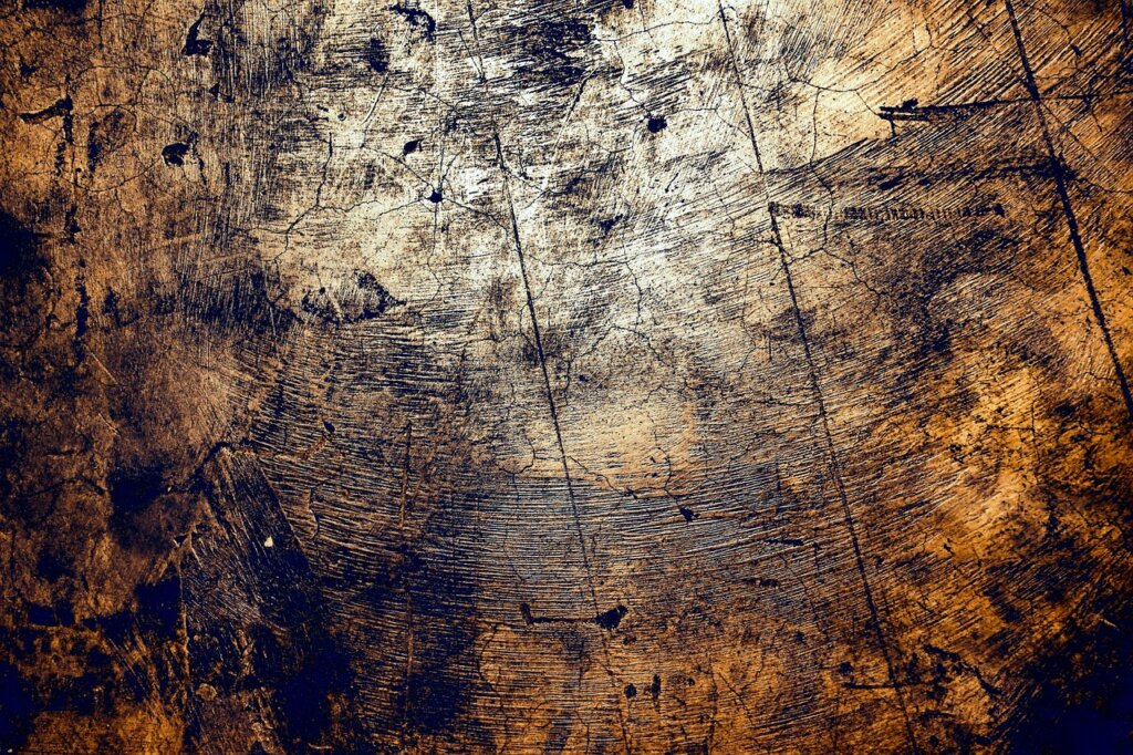 scratched vinyl floor with visible damage and lifting edge