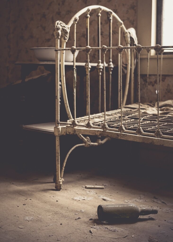 bed frame slats with accumulated dust and lint