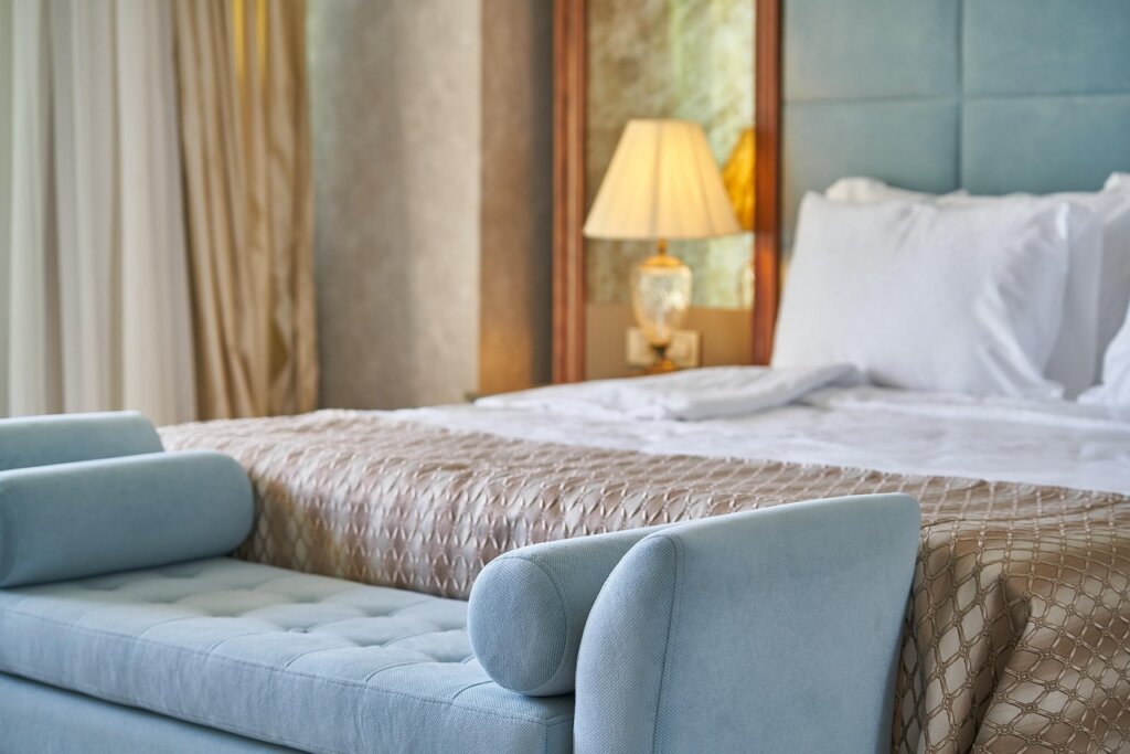 dust accumulation on wooden bed frame headboard