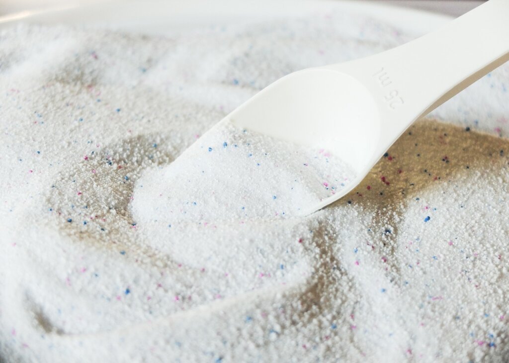laundry detergent overflowing from cup