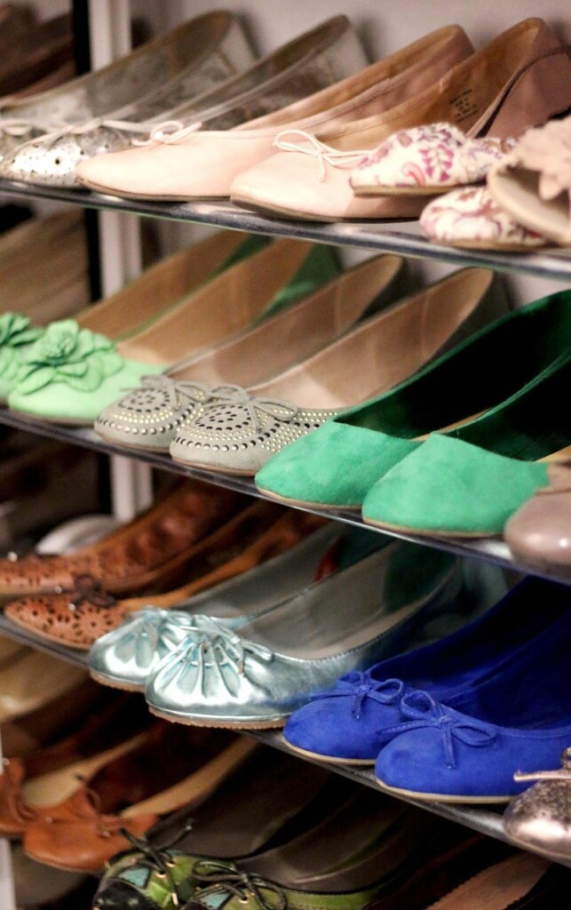organized shoe cabinet with wire shelf inserts and space between shoes