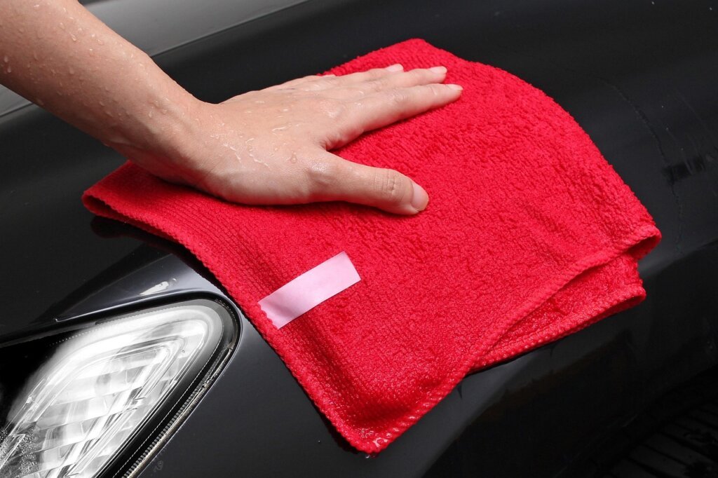 dry microfiber cloth wiping inside of drawer removing dust