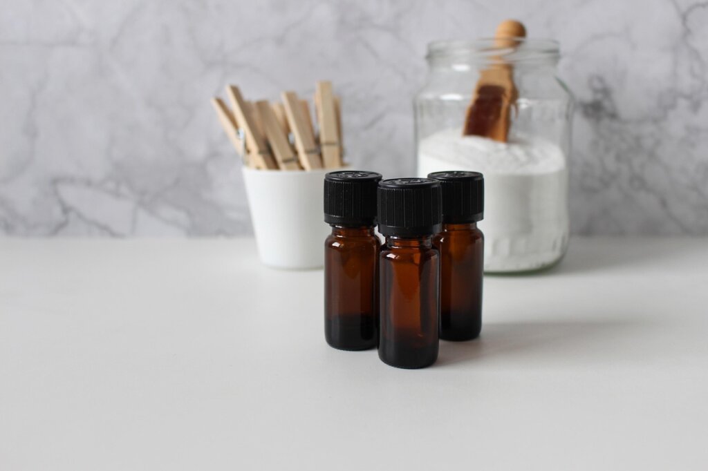 baking soda and citric acid cleaning supplies on white table