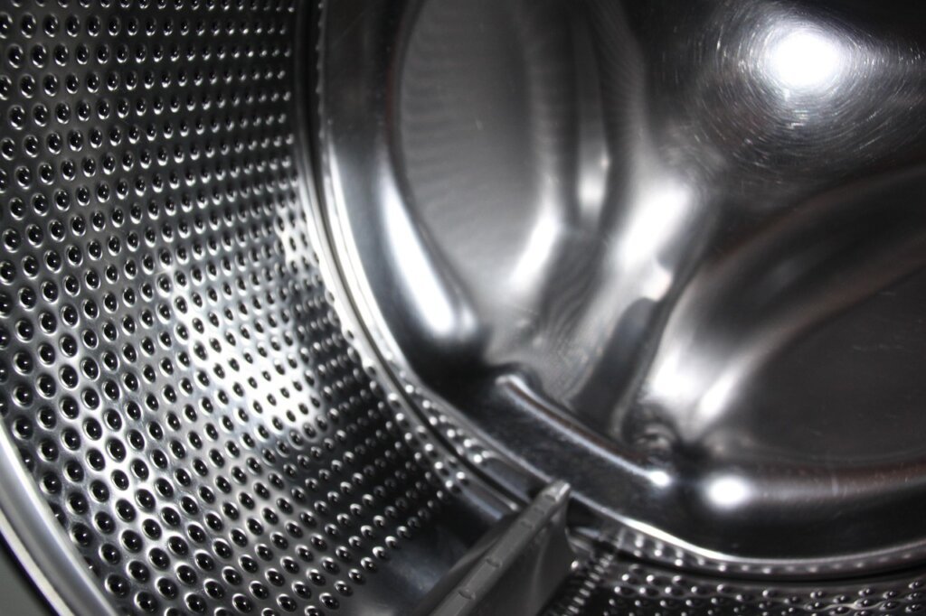 washing machine drum interior with residue buildup