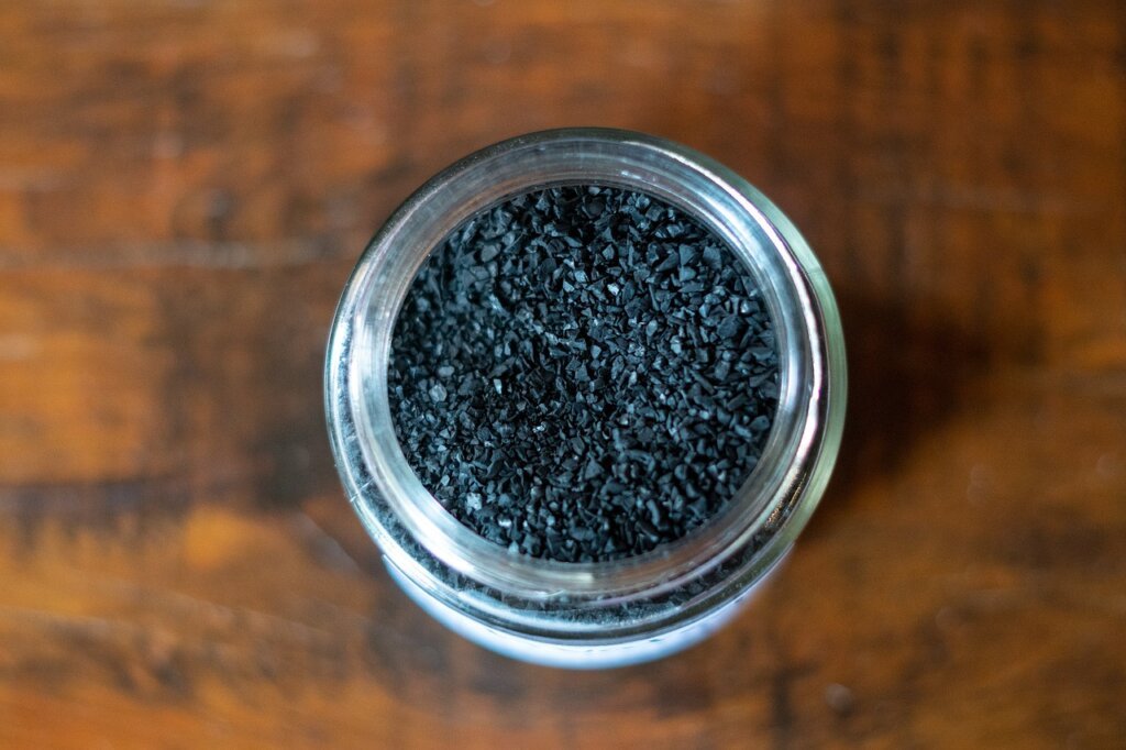 activated charcoal pouch placed on middle shelf of clean white wardrobe