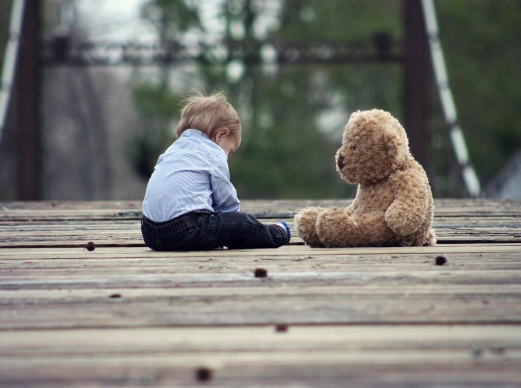 baby toys on wooden floor surrounded by dust and germs illustration
