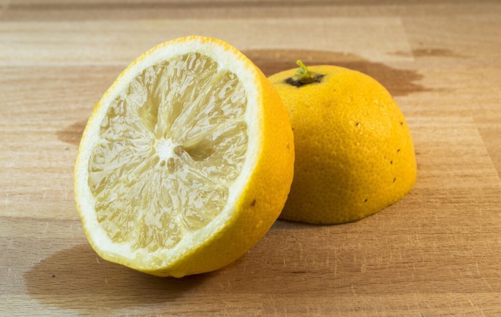 lemon citric acid paste applied on heavily stained sink drain area